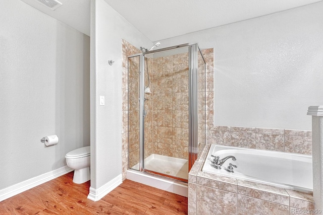 8943 Tappy Toorie Cir, Highlands Ranch, CO 80129 - full bath featuring a bath, a stall shower, toilet, and wood finished floors