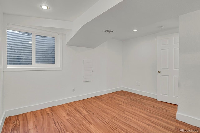 unfurnished room featuring recessed lighting, baseboards, visible vents, and light wood finished floors