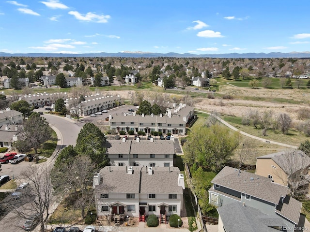 birds eye view of property with a mountain view