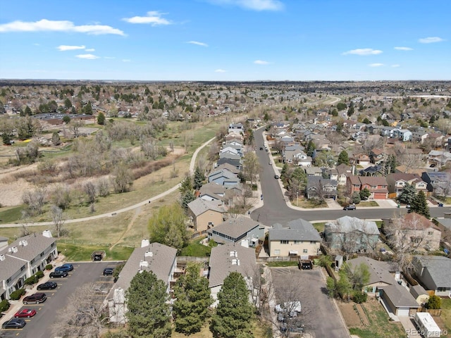 birds eye view of property with a residential view