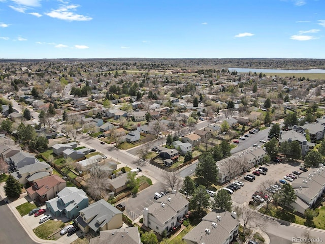 drone / aerial view featuring a residential view and a water view