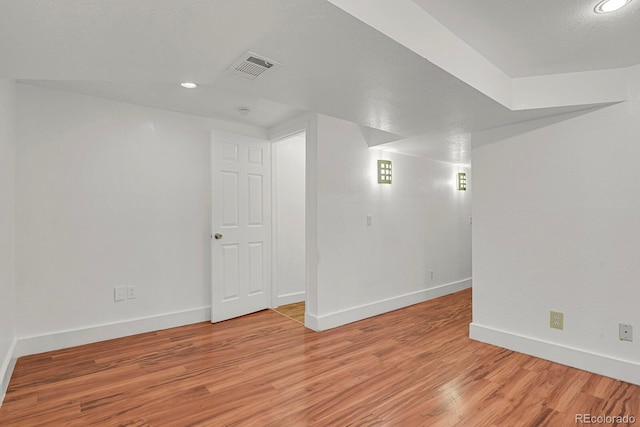 spare room with recessed lighting, baseboards, visible vents, and light wood-style flooring