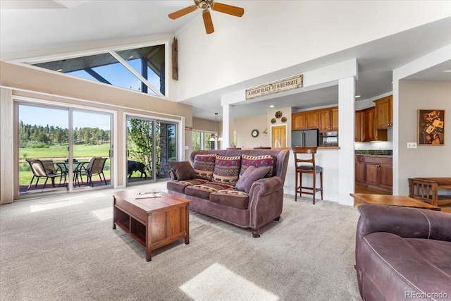 378 Fox Acres Dr W, Red Feather Lakes, CO 80545 - living area featuring light carpet, ceiling fan, and lofted ceiling