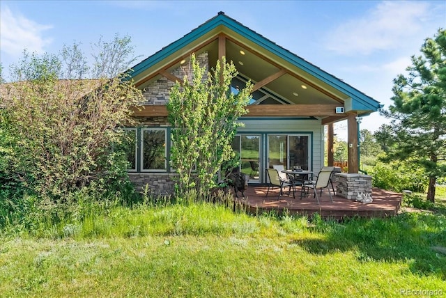 378 Fox Acres Dr W, Red Feather Lakes, CO 80545 - back of house with stone siding and a deck