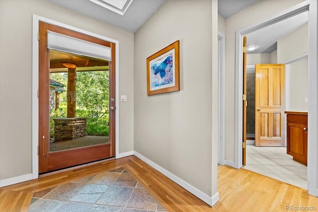 378 Fox Acres Dr W, Red Feather Lakes, CO 80545 - entryway with light wood-style floors and baseboards