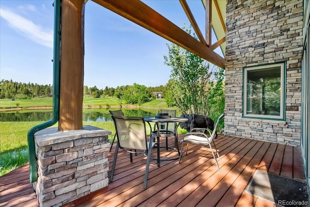 378 Fox Acres Dr W, Red Feather Lakes, CO 80545 - wooden terrace featuring a water view and view of scattered trees