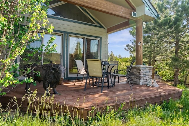 378 Fox Acres Dr W, Red Feather Lakes, CO 80545 - wooden terrace featuring outdoor dining area
