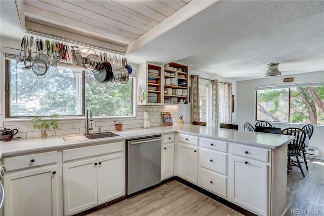 kitchen featuring dishwasher, ceiling fan, light hardwood / wood-style flooring, and white cabinets