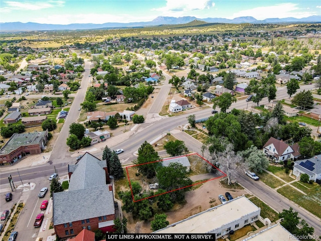 drone / aerial view featuring a mountain view