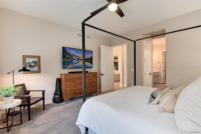 carpeted bedroom featuring ceiling fan and connected bathroom