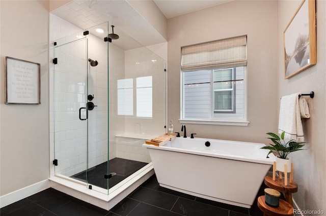 bathroom with tile patterned flooring and shower with separate bathtub