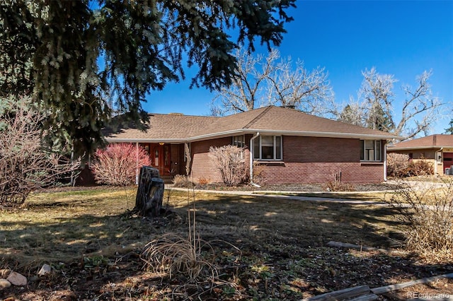 view of side of property featuring brick siding