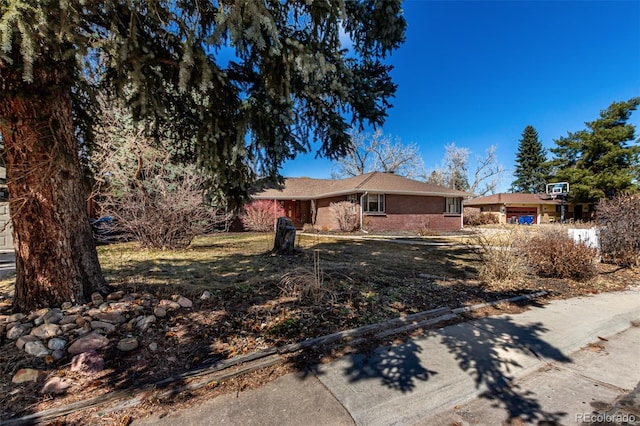 single story home with brick siding