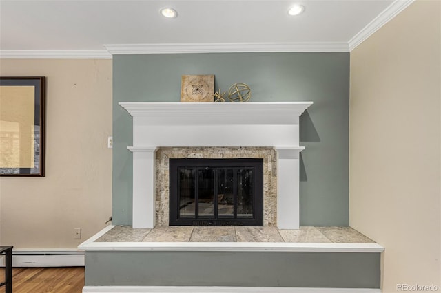 room details featuring ornamental molding, a tile fireplace, wood finished floors, and a baseboard radiator