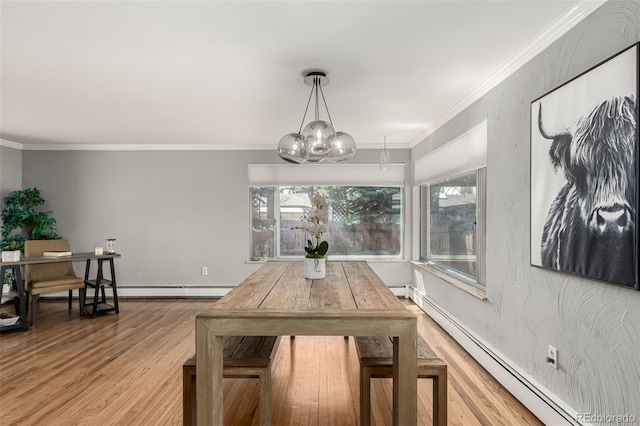 dining area featuring a baseboard heating unit, an inviting chandelier, wood finished floors, and ornamental molding