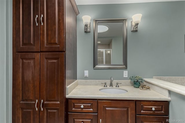 bathroom with an enclosed shower and vanity