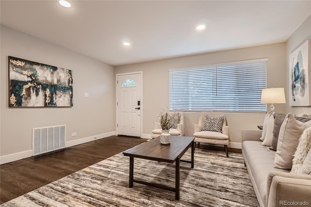 living room featuring dark hardwood / wood-style floors