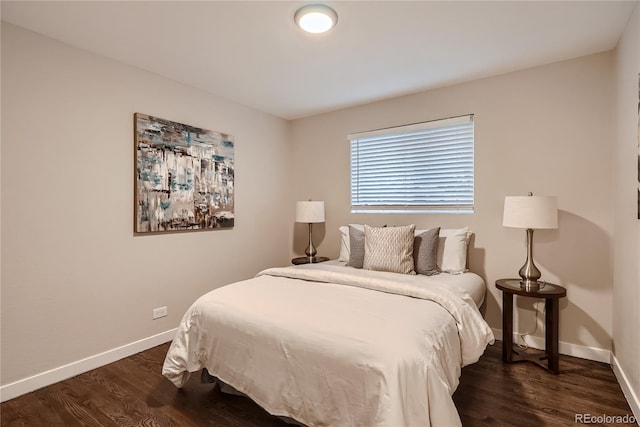 bedroom featuring dark hardwood / wood-style floors