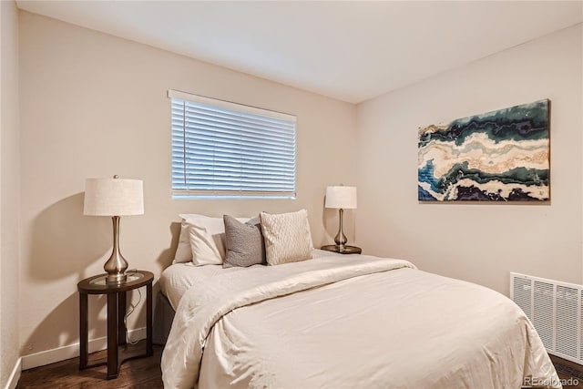 bedroom featuring dark wood-type flooring