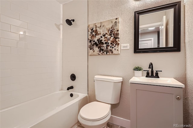 full bathroom with vanity, toilet, and tiled shower / bath