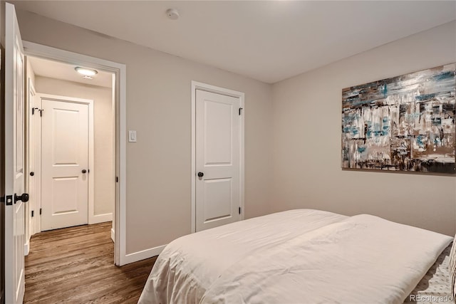 bedroom featuring hardwood / wood-style flooring