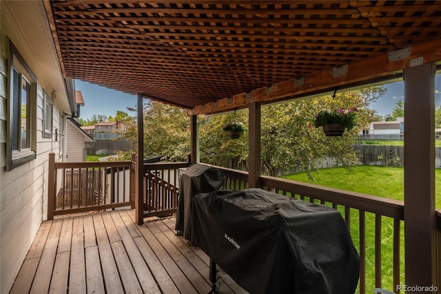 wooden deck featuring area for grilling