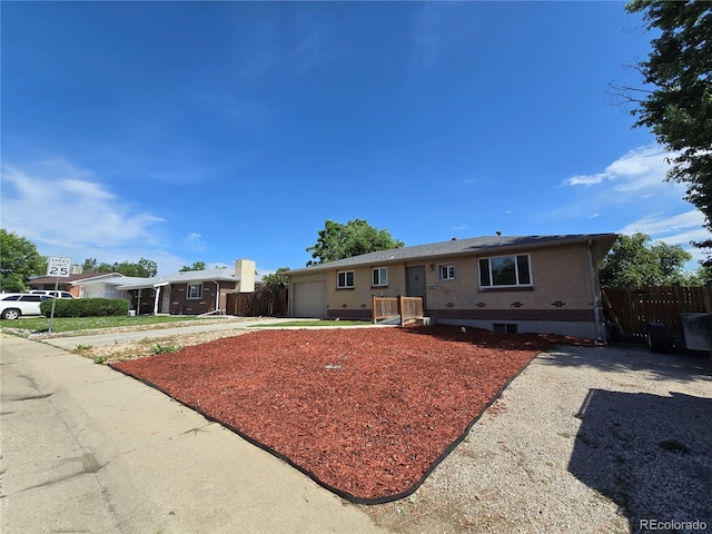 2865 Carnation Way, Thornton, CO 80229 - ranch-style house featuring an attached garage and brick siding