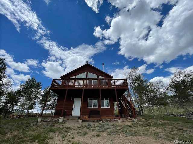 69 Noxibee Ct, Como, CO 80432 - back of house with a wooden deck and stairs