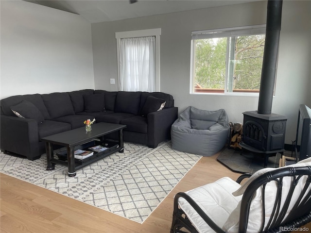 69 Noxibee Ct, Como, CO 80432 - living room with light wood finished floors and a wood stove