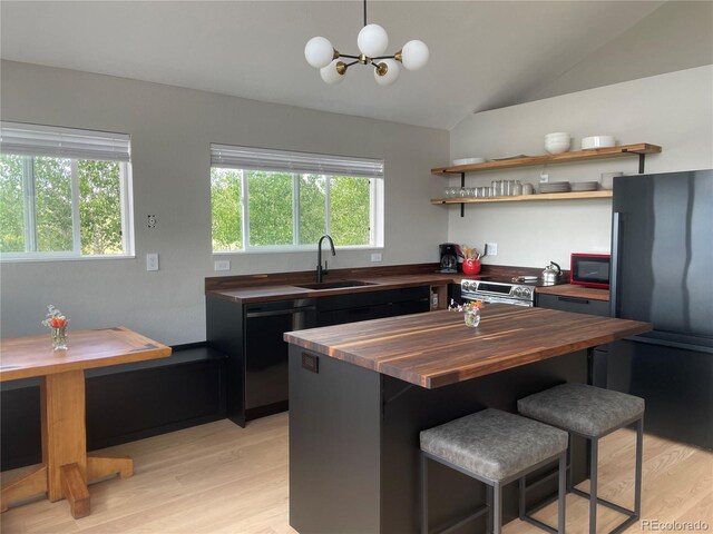 69 Noxibee Ct, Como, CO 80432 - kitchen featuring butcher block counters, dishwasher, freestanding refrigerator, stainless steel range with electric stovetop, and light wood finished floors
