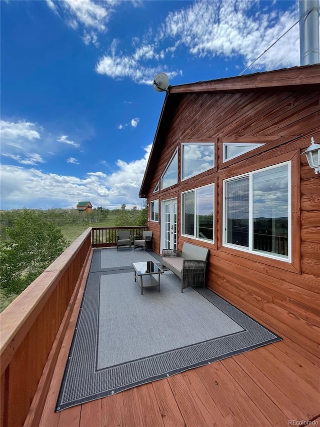 69 Noxibee Ct, Como, CO 80432 - deck with french doors and an outdoor living space