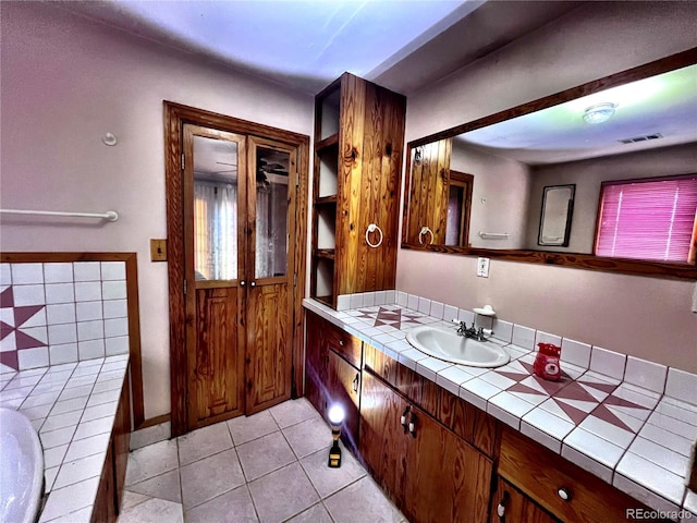 bathroom with vanity and tile patterned flooring