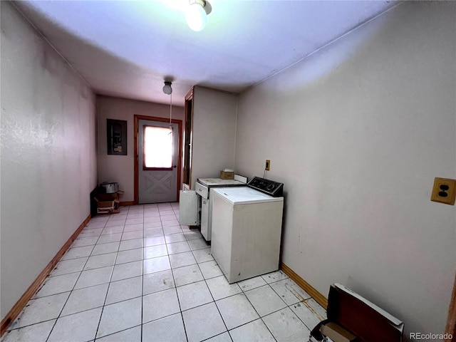 laundry area with light tile patterned floors