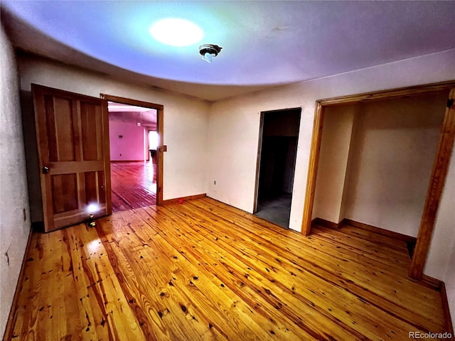 unfurnished bedroom featuring wood-type flooring