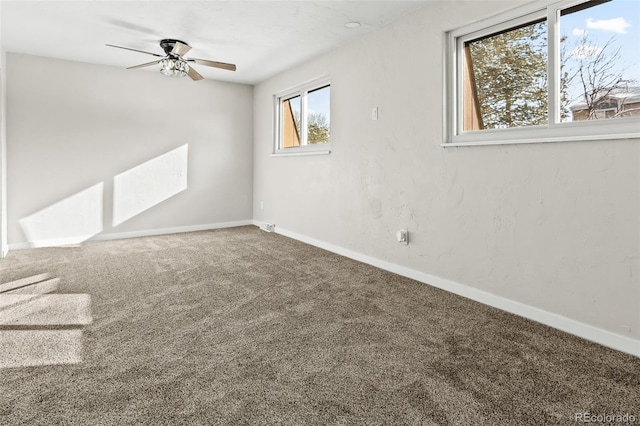 empty room featuring ceiling fan and carpet floors