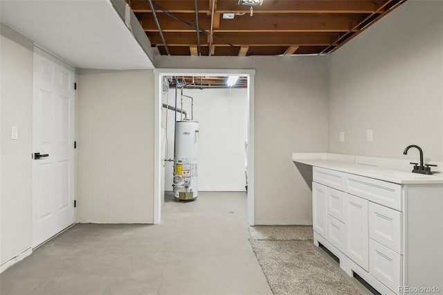 basement featuring water heater and sink