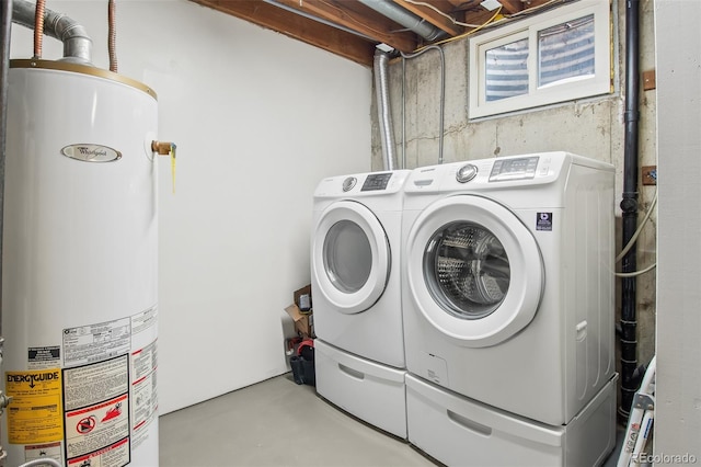 washroom with water heater and separate washer and dryer