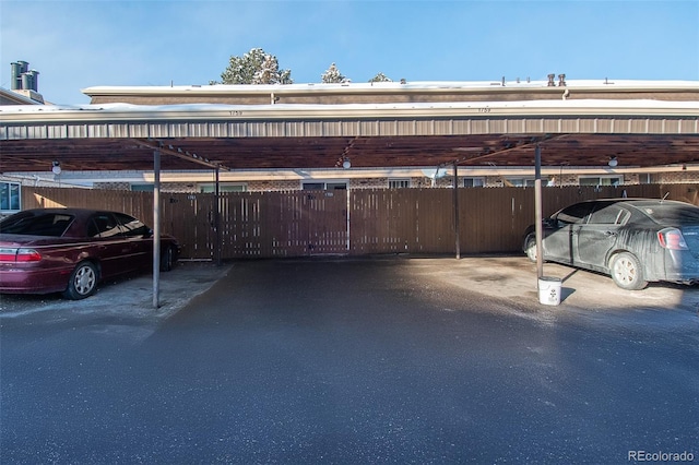 covered parking lot with fence