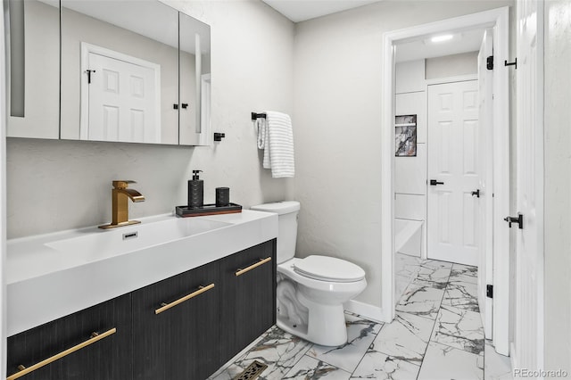 bathroom with toilet and vanity