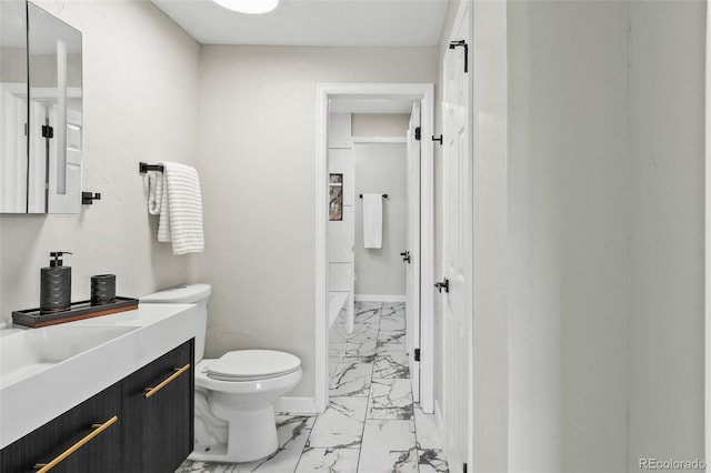 bathroom with toilet and vanity