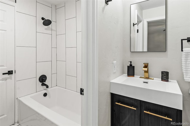 bathroom featuring vanity and tiled shower / bath combo