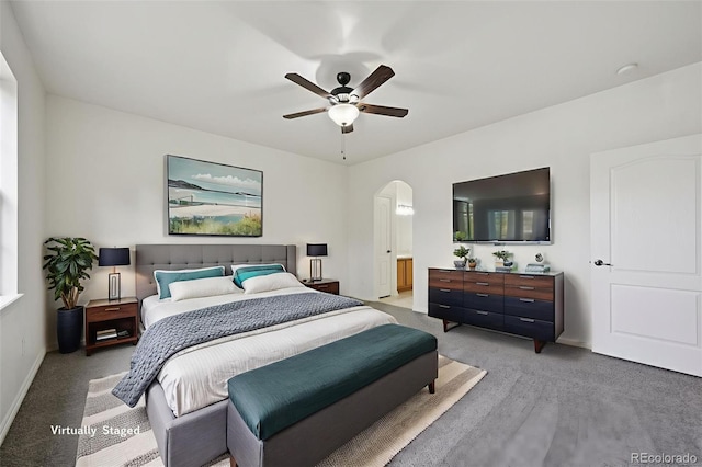 4672 W 20th Street Rd Unit 2511, Greeley, CO 80634 - bedroom with arched walkways, light carpet, baseboards, and ceiling fan