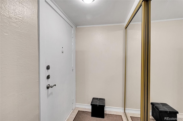 doorway to outside featuring ornamental molding