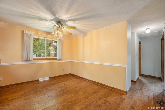 8269 Zephyr St, Arvada, CO 80005 - spare room with hardwood / wood-style flooring, ceiling fan, baseboards, and a textured ceiling