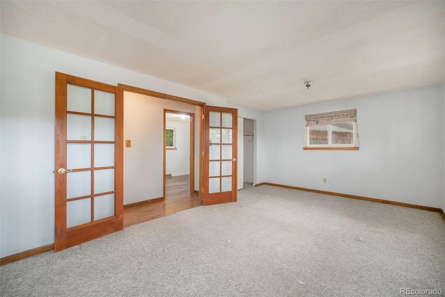 8269 Zephyr St, Arvada, CO 80005 - carpeted spare room featuring french doors and baseboards