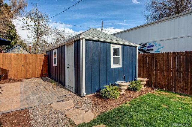 view of outbuilding with an outbuilding and a fenced backyard