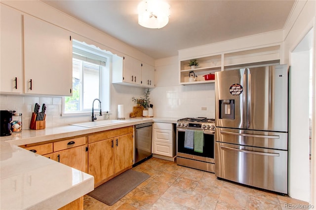kitchen with light countertops, a sink, backsplash, and stainless steel appliances