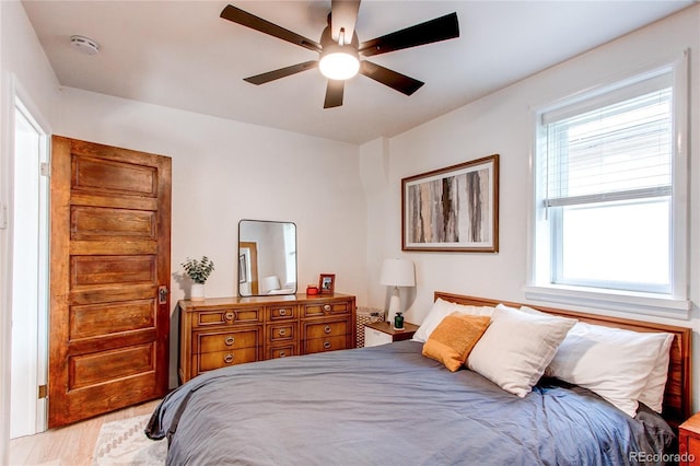 bedroom featuring light wood-style floors and ceiling fan