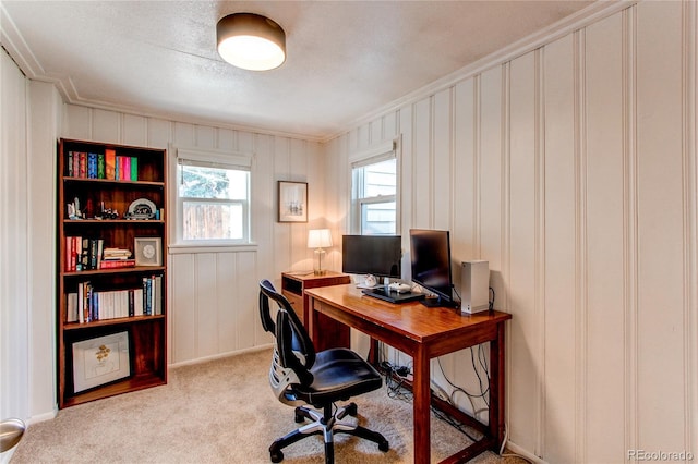 carpeted office with ornamental molding