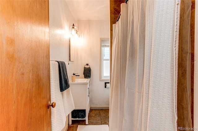 full bath with vanity and a shower with curtain